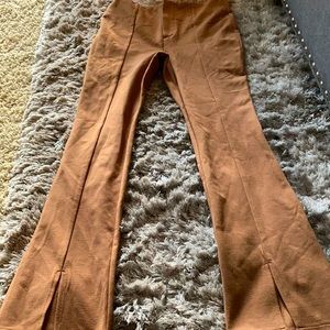 Light tan pants with slit on the bottom
